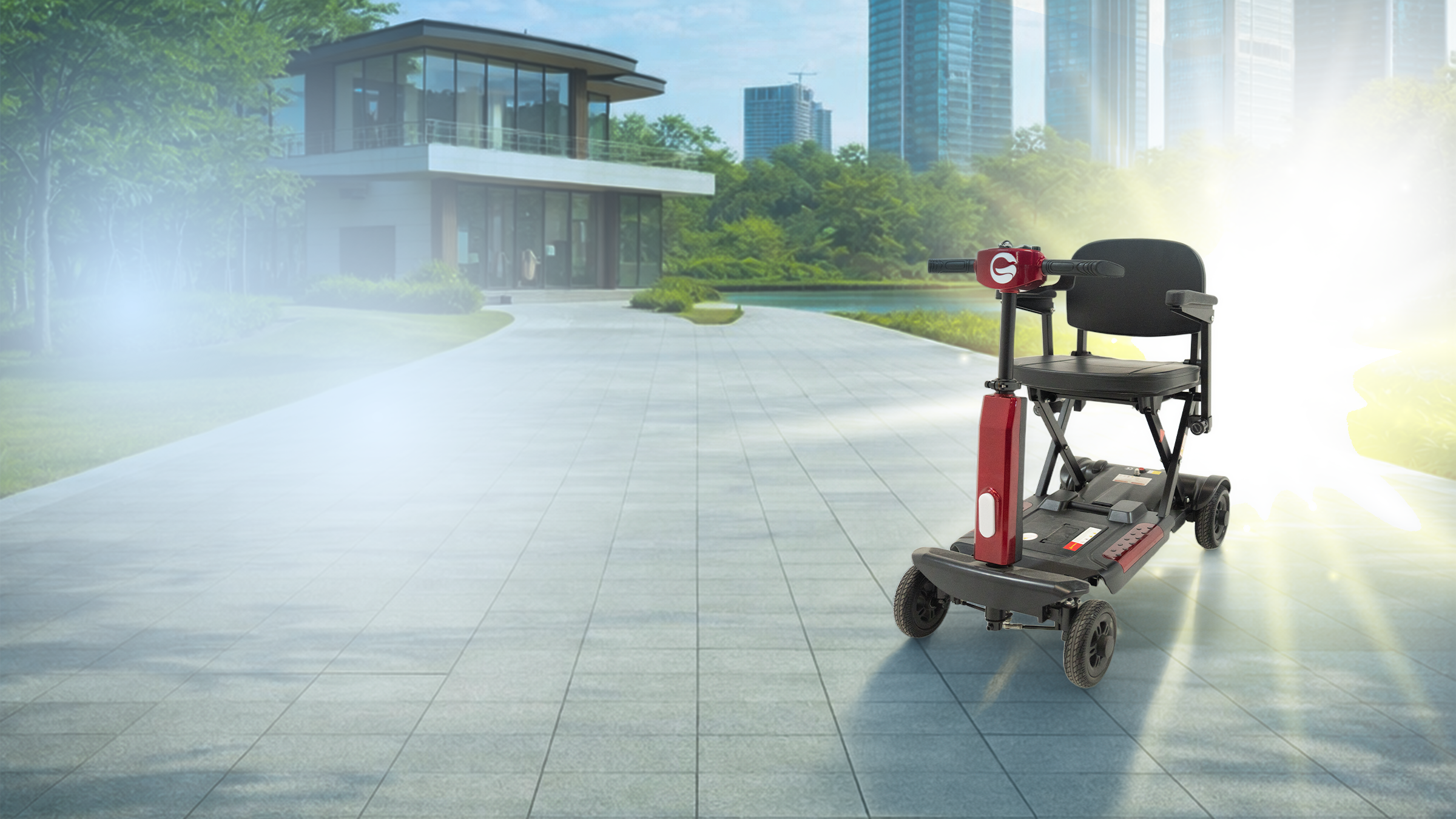 A red and black electric mobility scooter with four wheels is shown on a paved outdoor path in a modern residential area with trees, a house, and tall buildings in the background. Bright sunlight is shining from the right side of the scene.